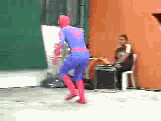 spiderman slipping on a wall