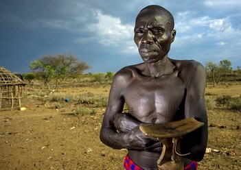 Pokhot man holding a headrest - Kenya