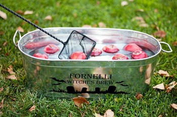 Fishing for apples in a metal tub