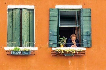 Murano. Woman in open window.