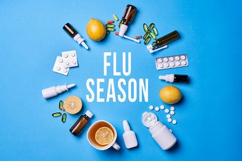 Flue season background with medical supplies and healthy fruits