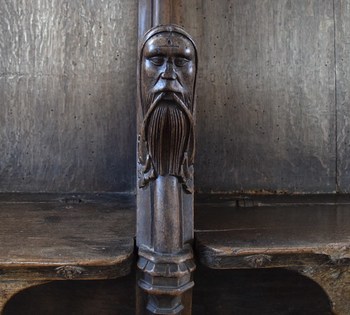 bearded man on an armrest
