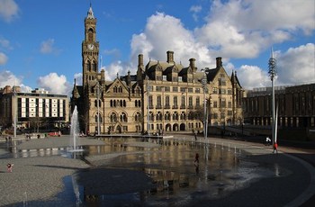 Bradford City Hall & The Mirror Pool, City Park, Centenary Square, Bradford, West Yorkshire, England.