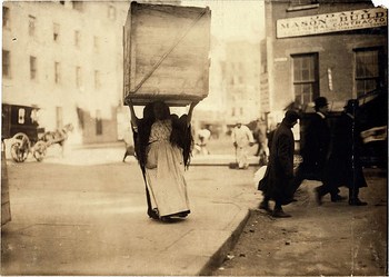 Hine, Lewis (1874-1940) - 1912 Italian Woman Carrying Dry-Goods Box, New York