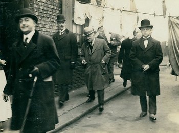 Neville Chamberlain surveying Newcastle's slums